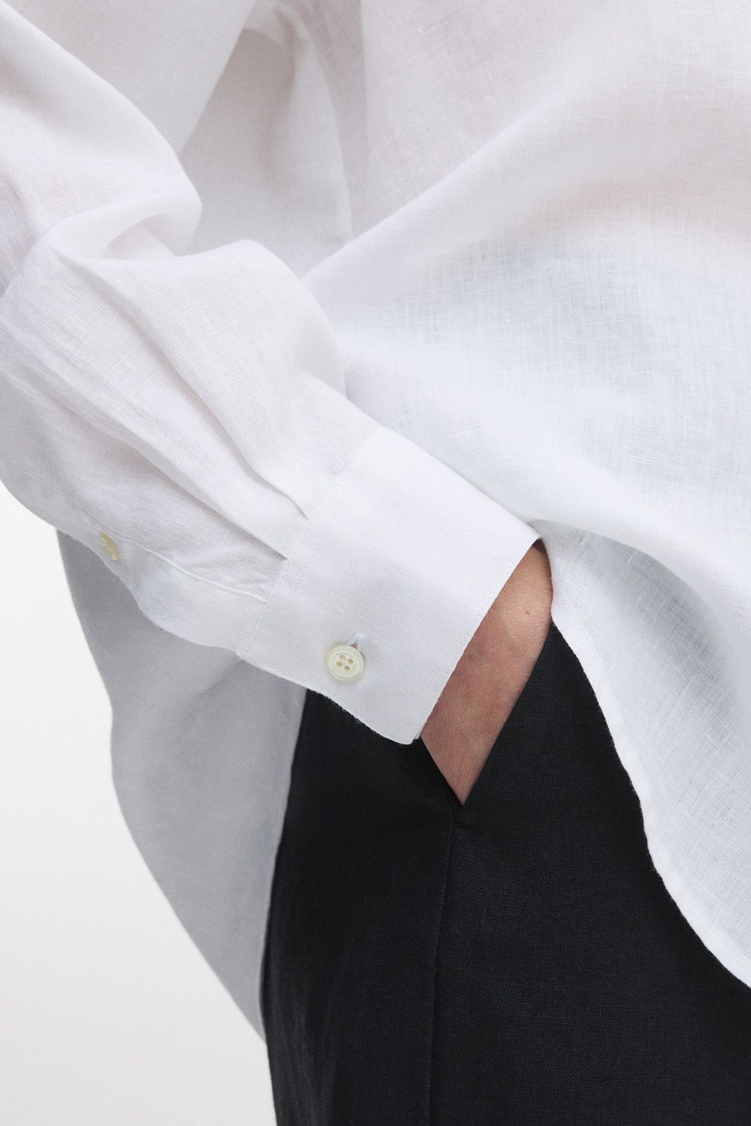 Knife pleats and sharp, single buttoned cuffs