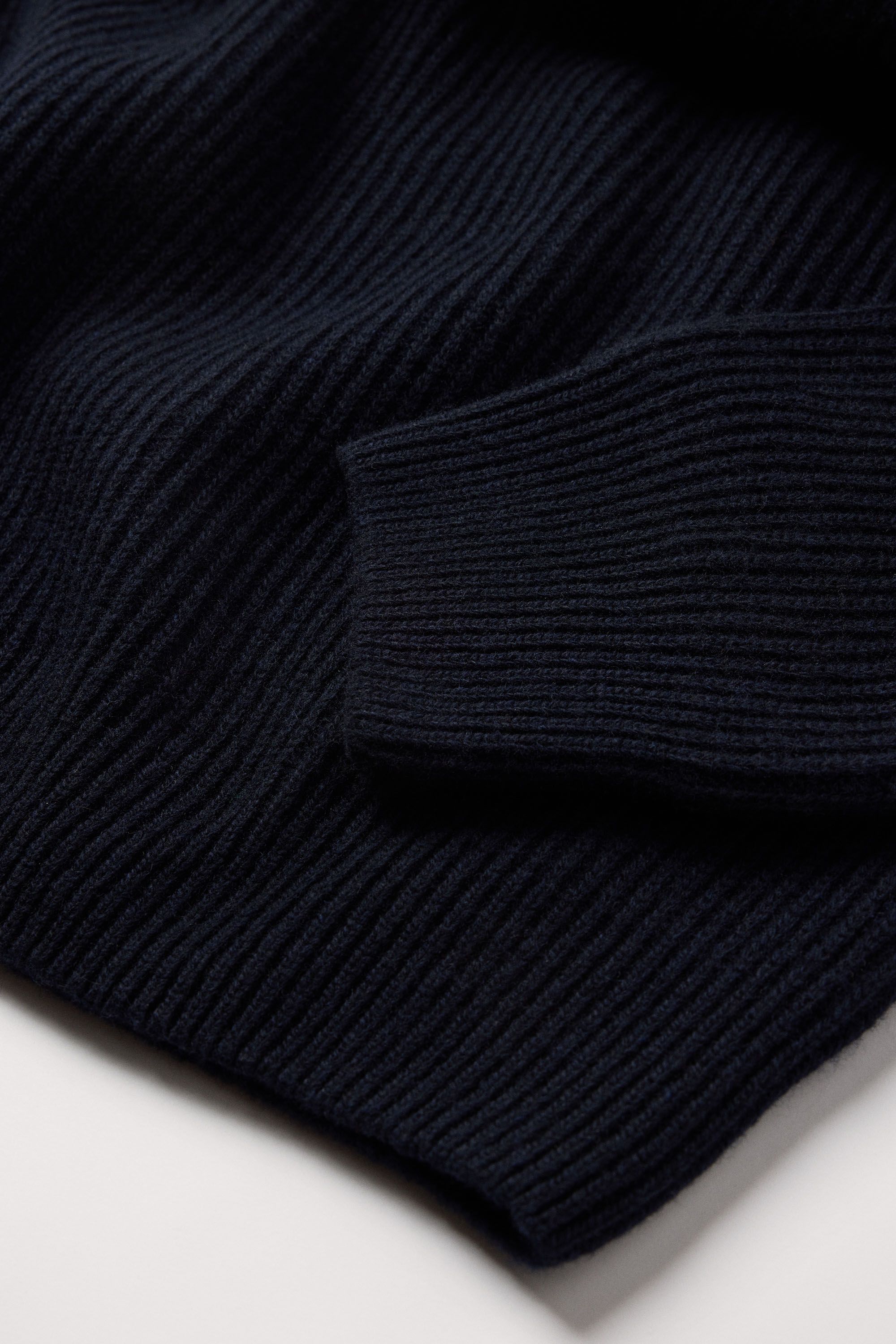 1x1 ribbed "grown on" cuffs and hems for a clean transition