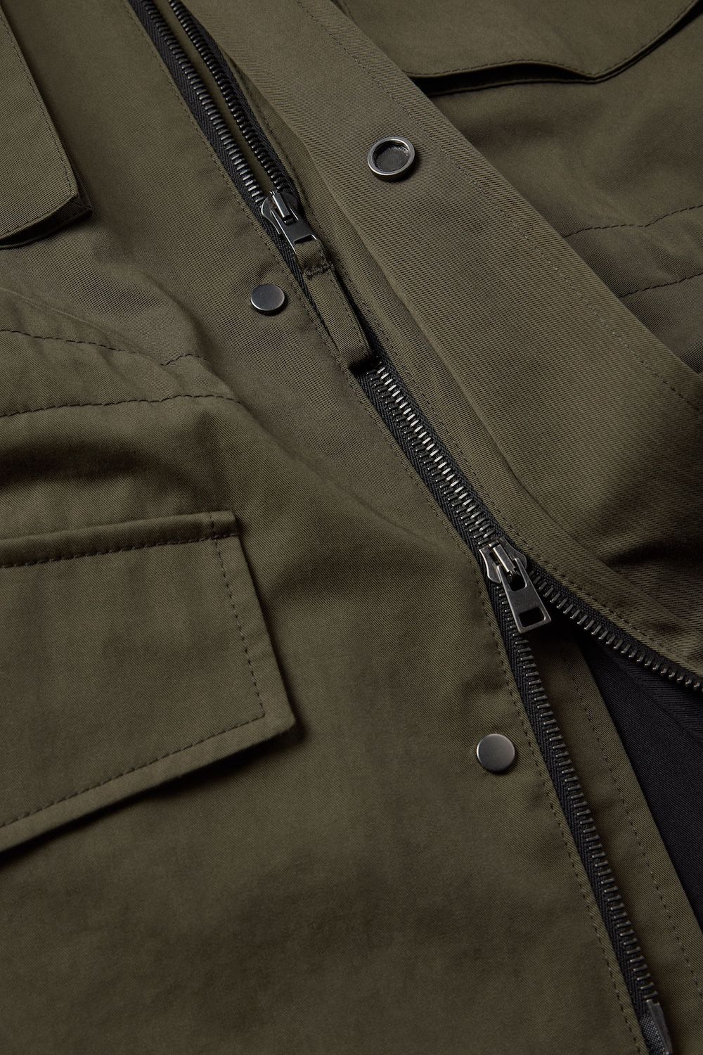 Swiss made Riri hardware, including hidden two-way zipper and snap button placket