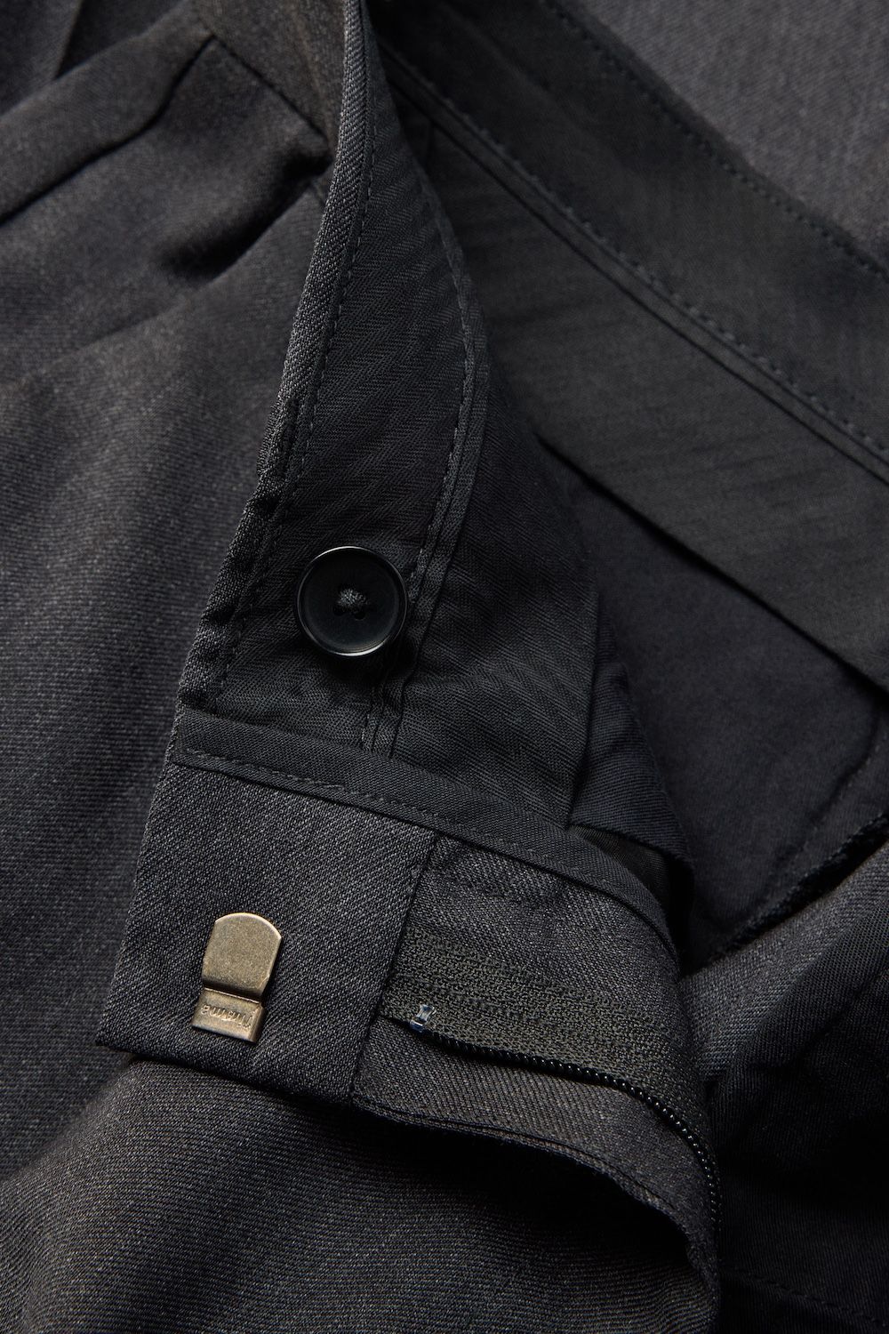 Tailored waistband with hidden hook and button