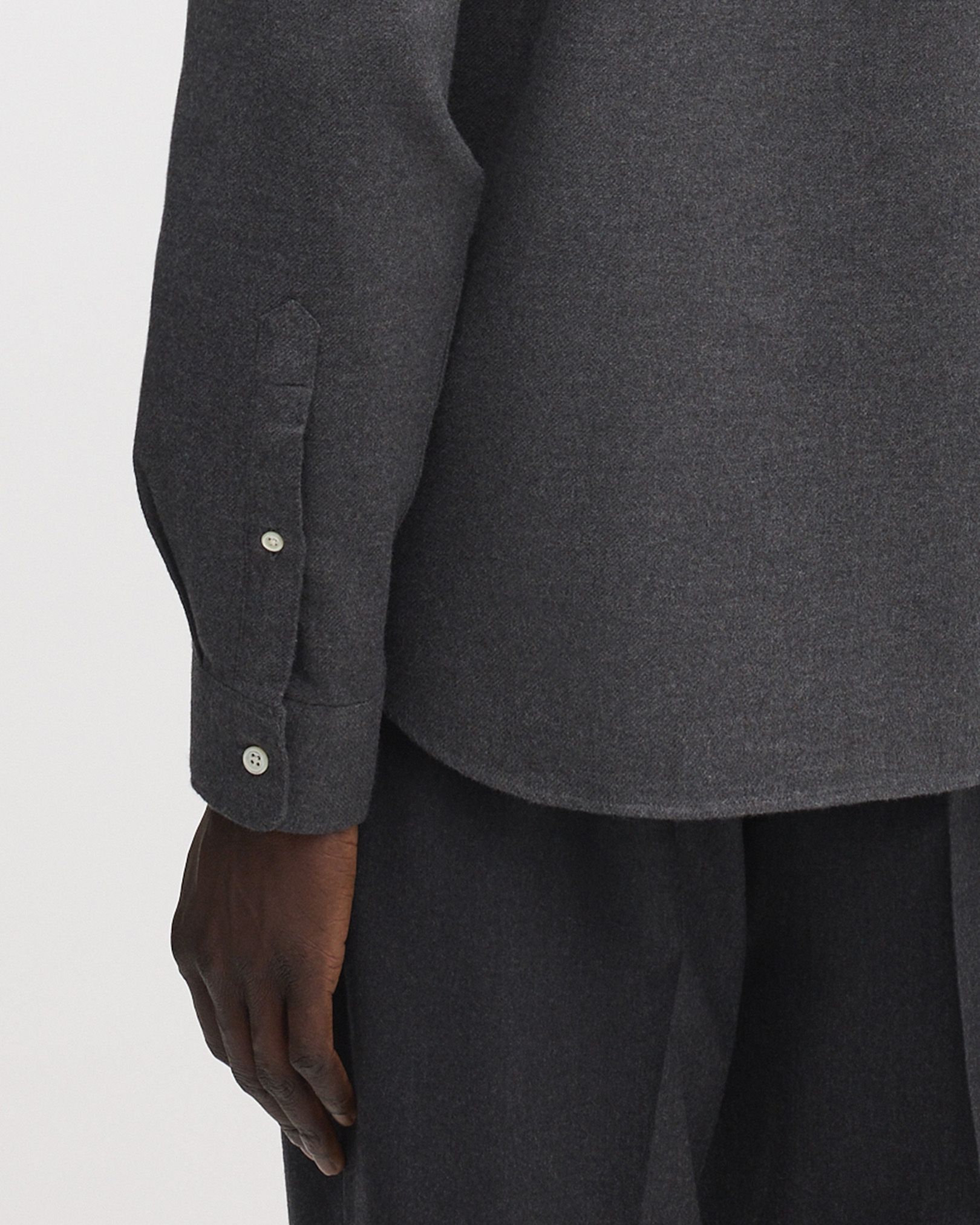 Rounded, single button cuffs