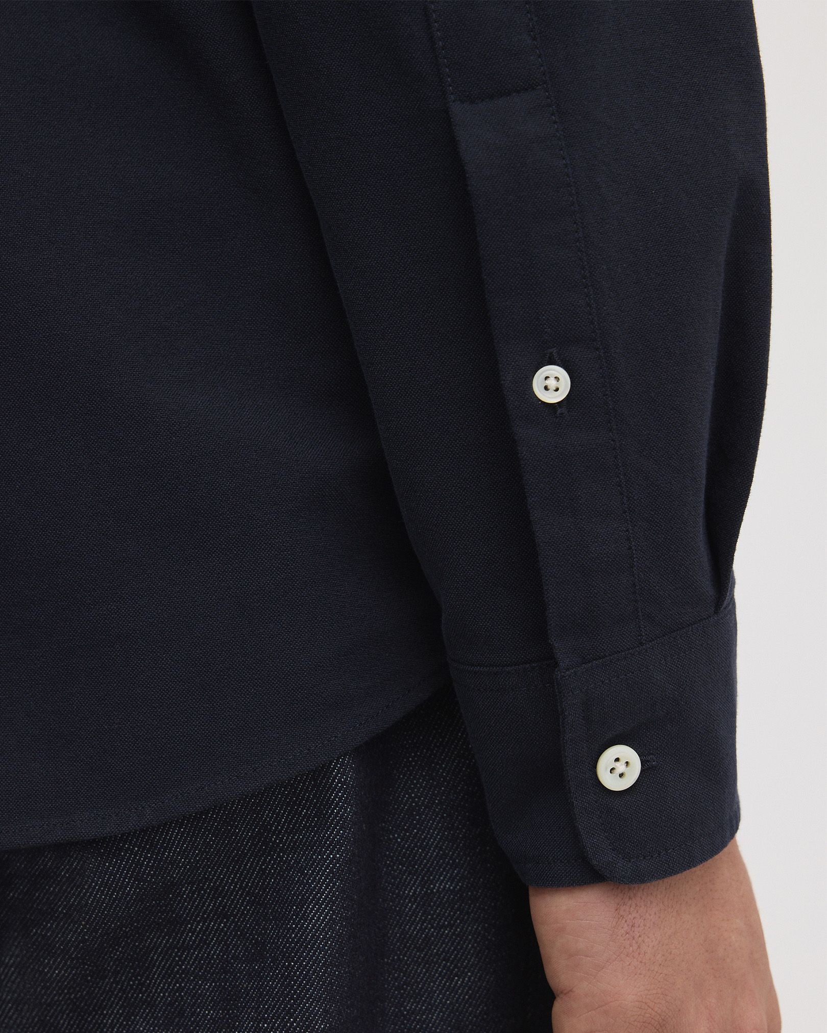 Rounded, single button cuffs