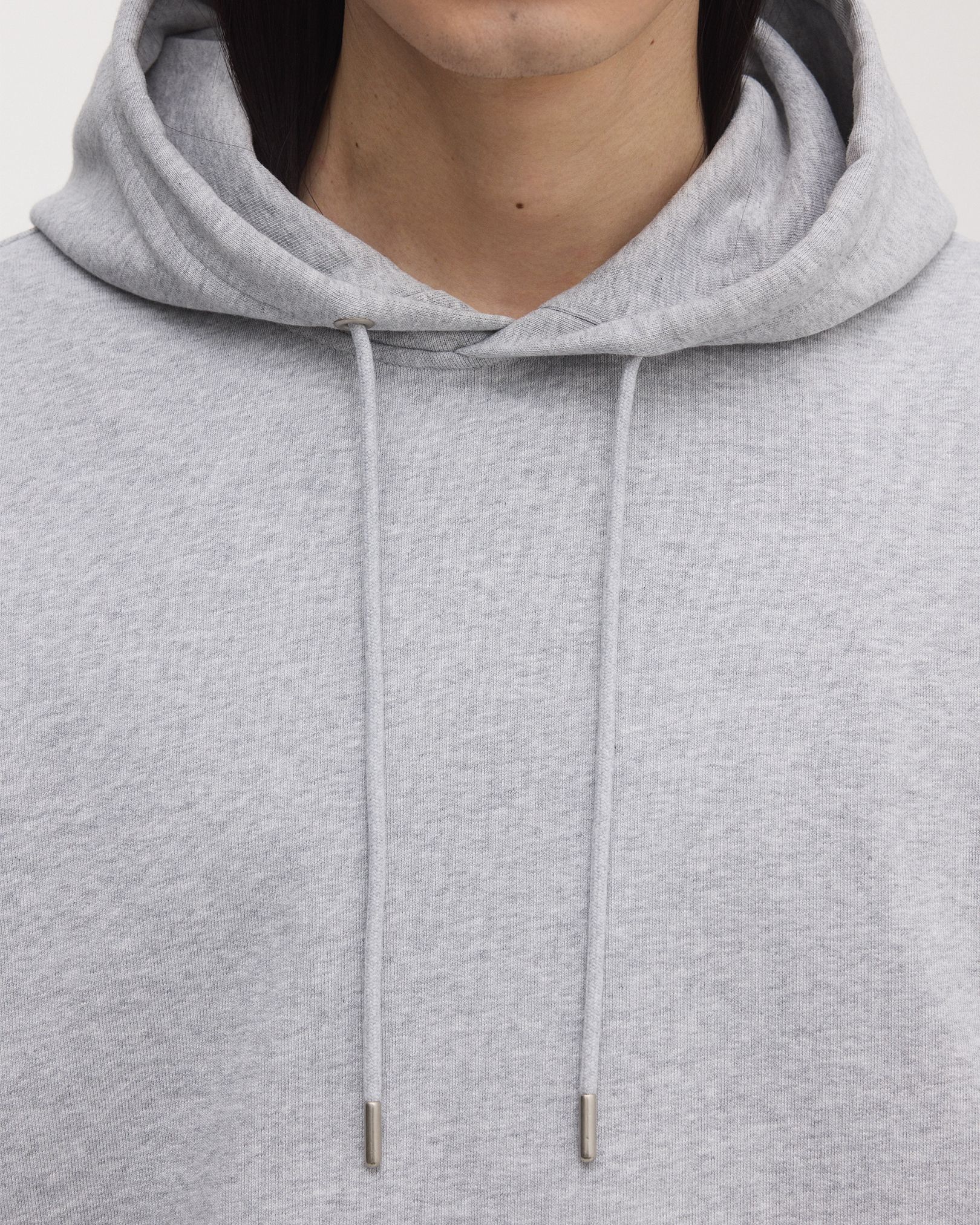 Double lined hood, with tonal drawstrings and brushed metal details