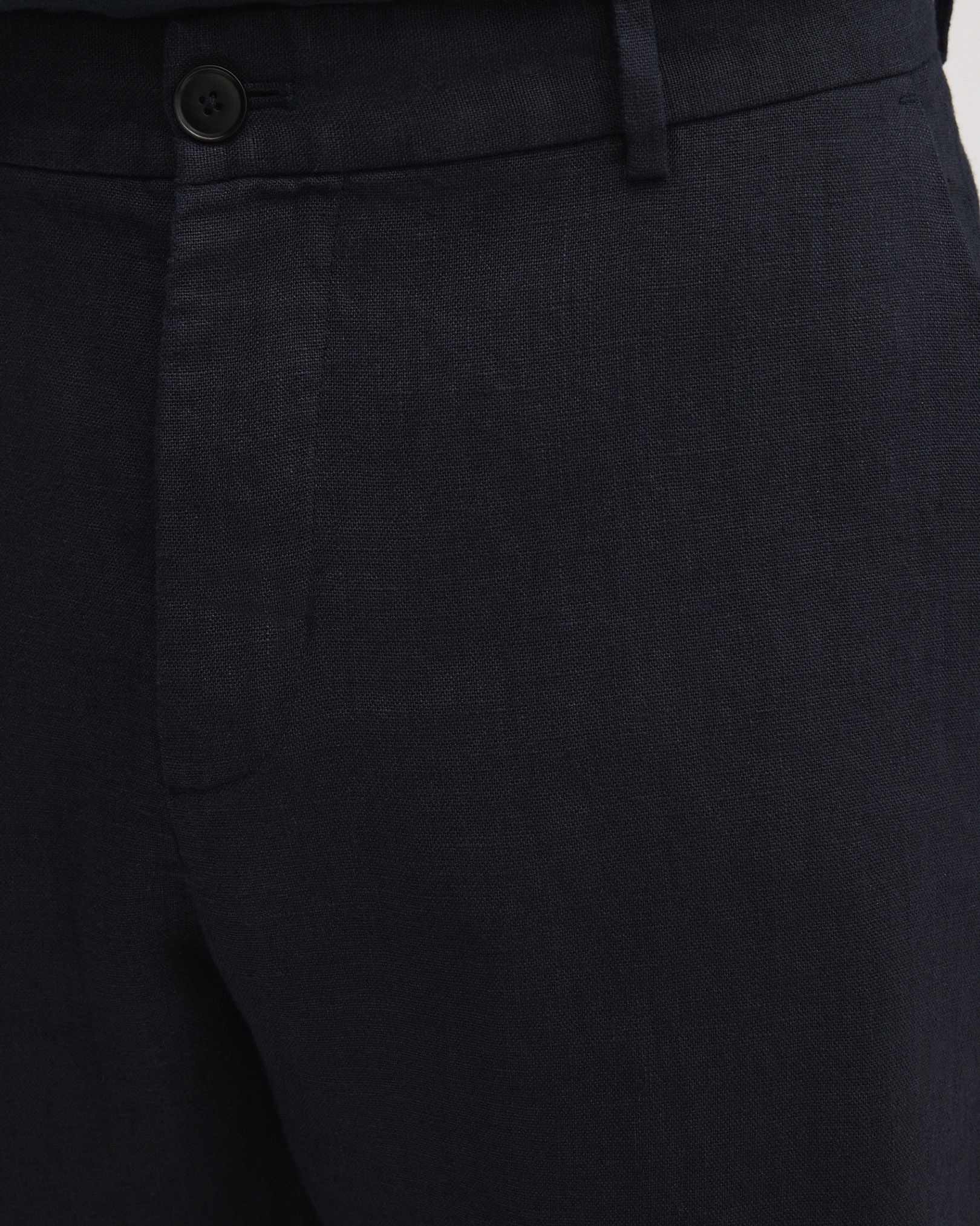 Zip closure with 1 button at the front and 1 button on the inside of the waistband