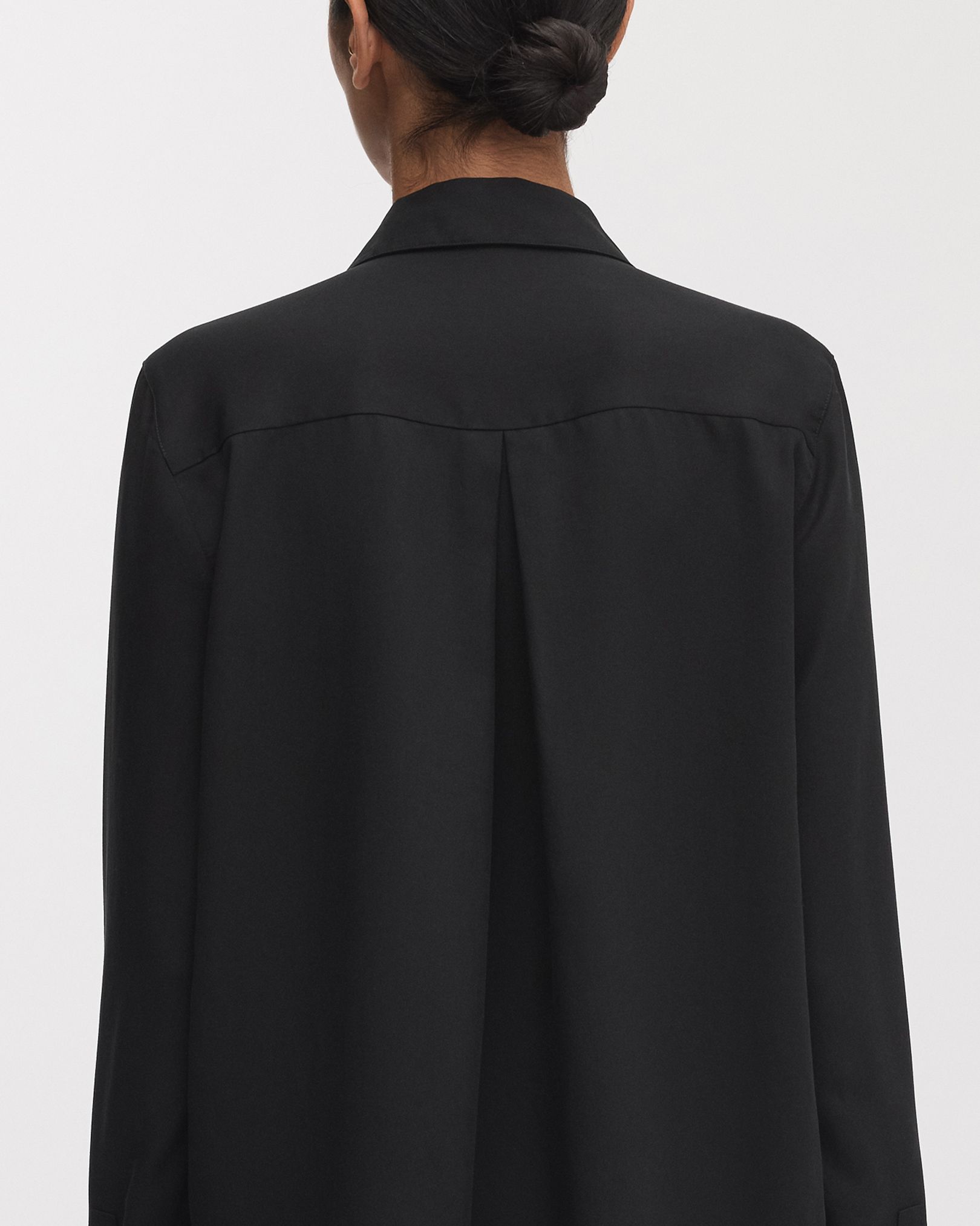 Pleat at back for drape and freedom of movement