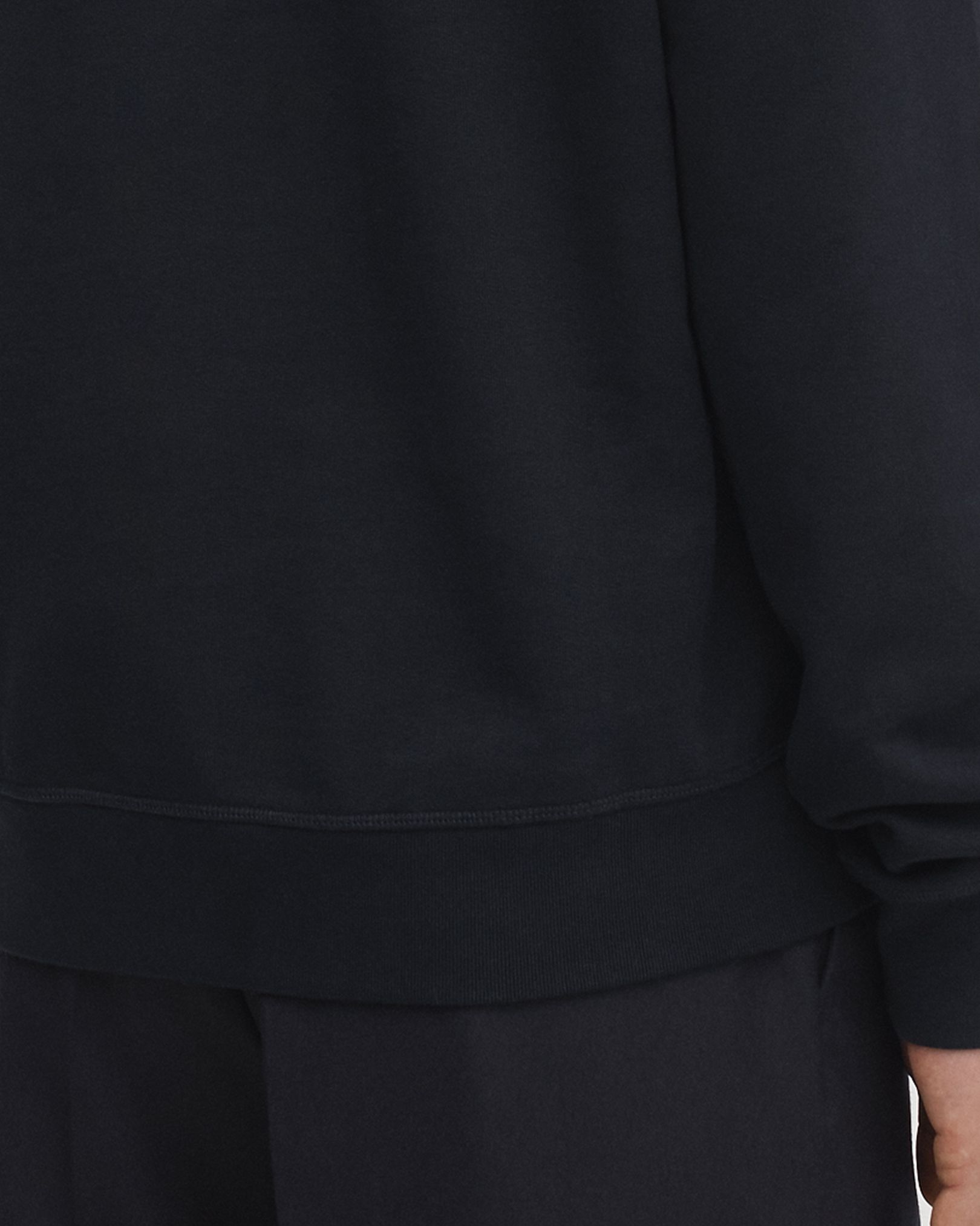 Flatlock stitch finishing at hem, cuffs and neckline