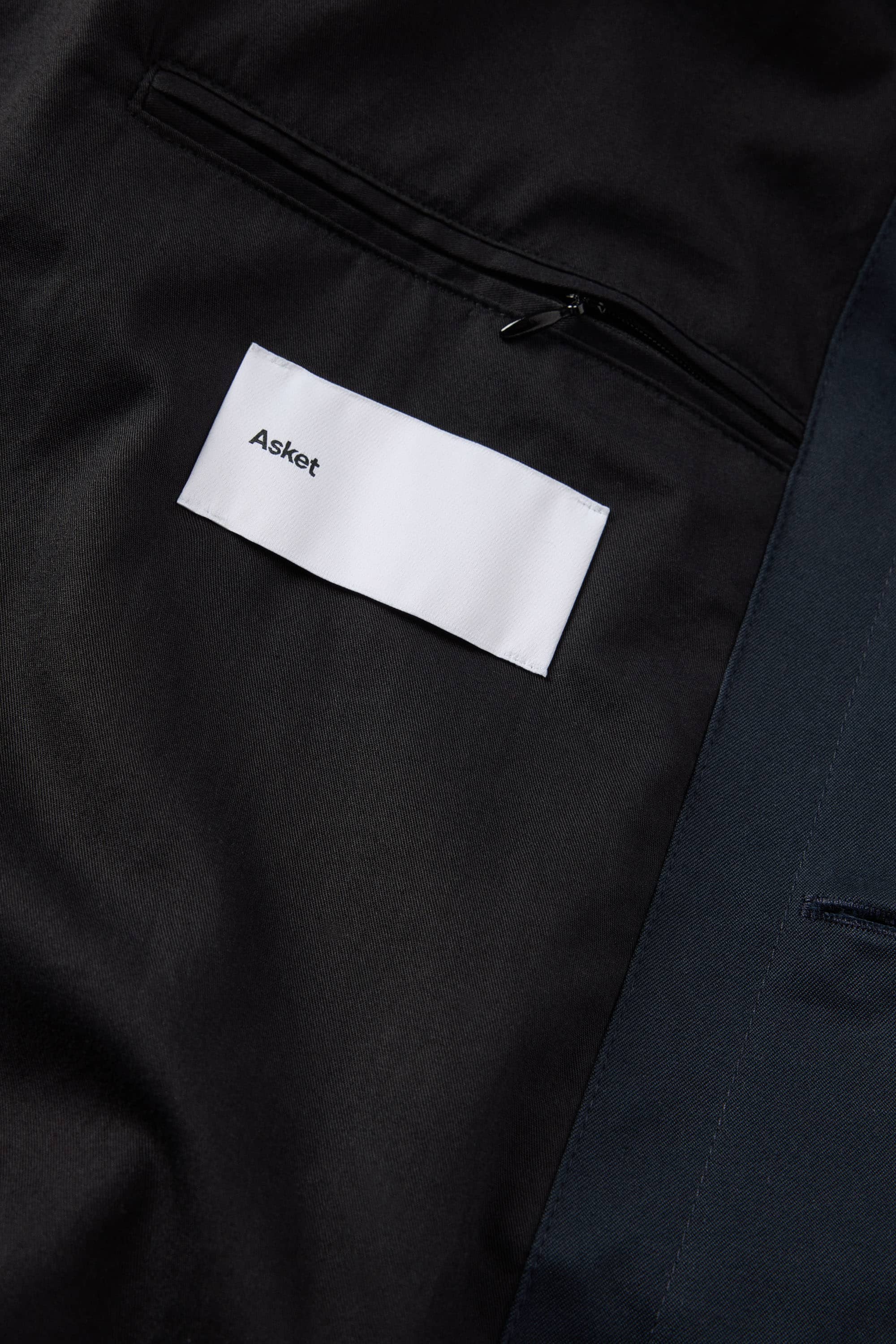 Interior jet pocket with zip closure on left side