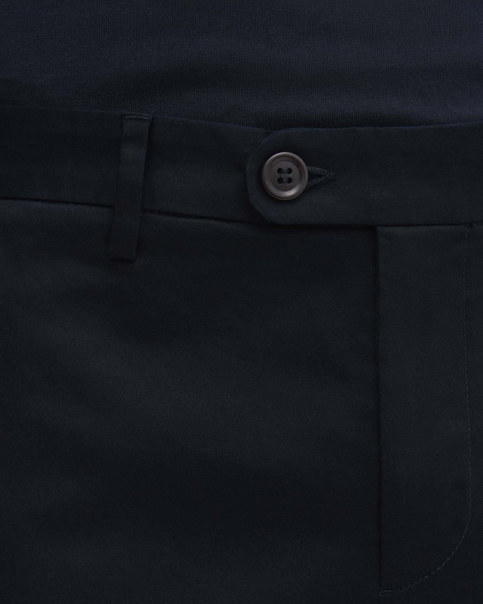 Overlapping waistband with button and hook closure