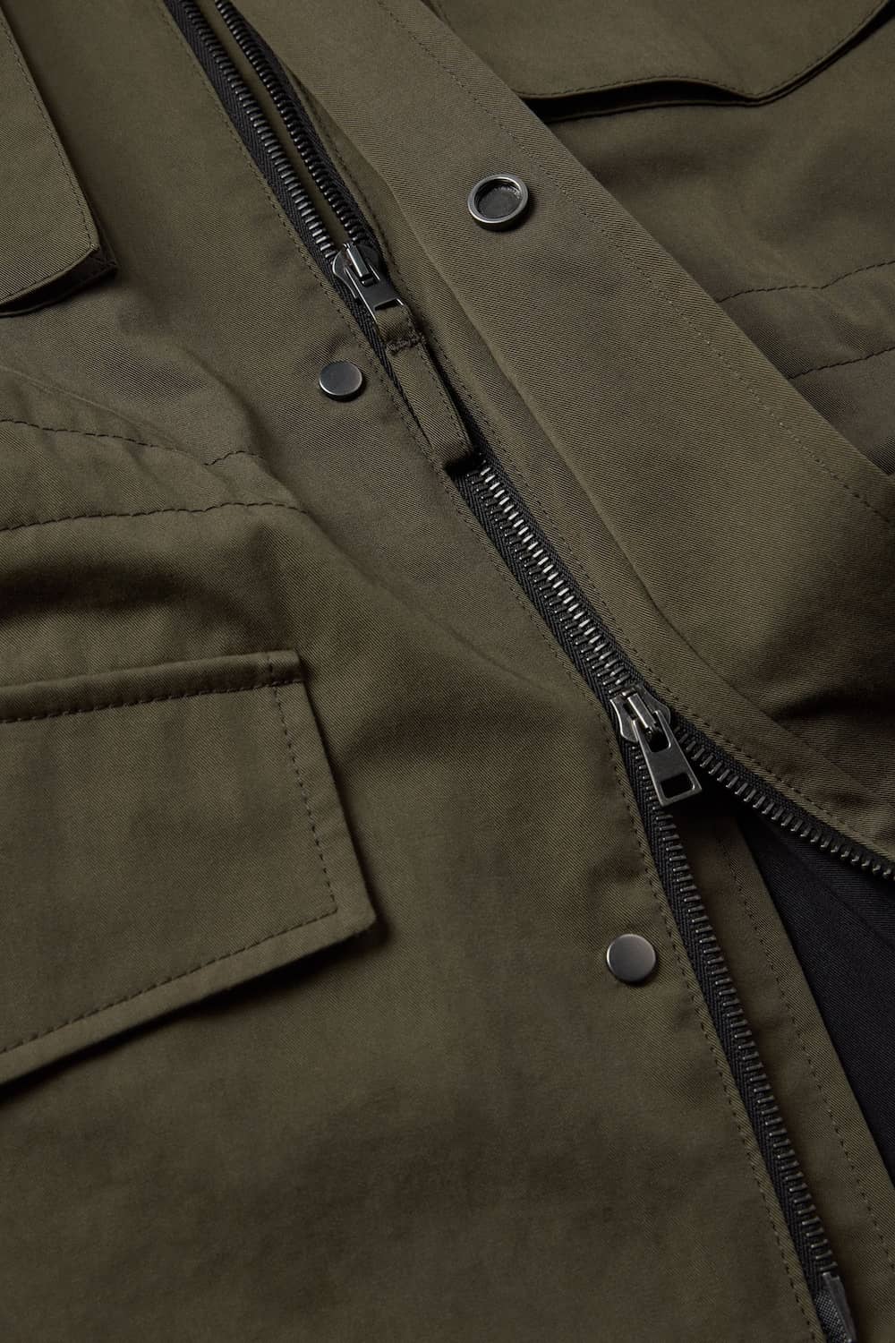 Swiss made Riri hardware, including hidden two-way zipper and snap button placket