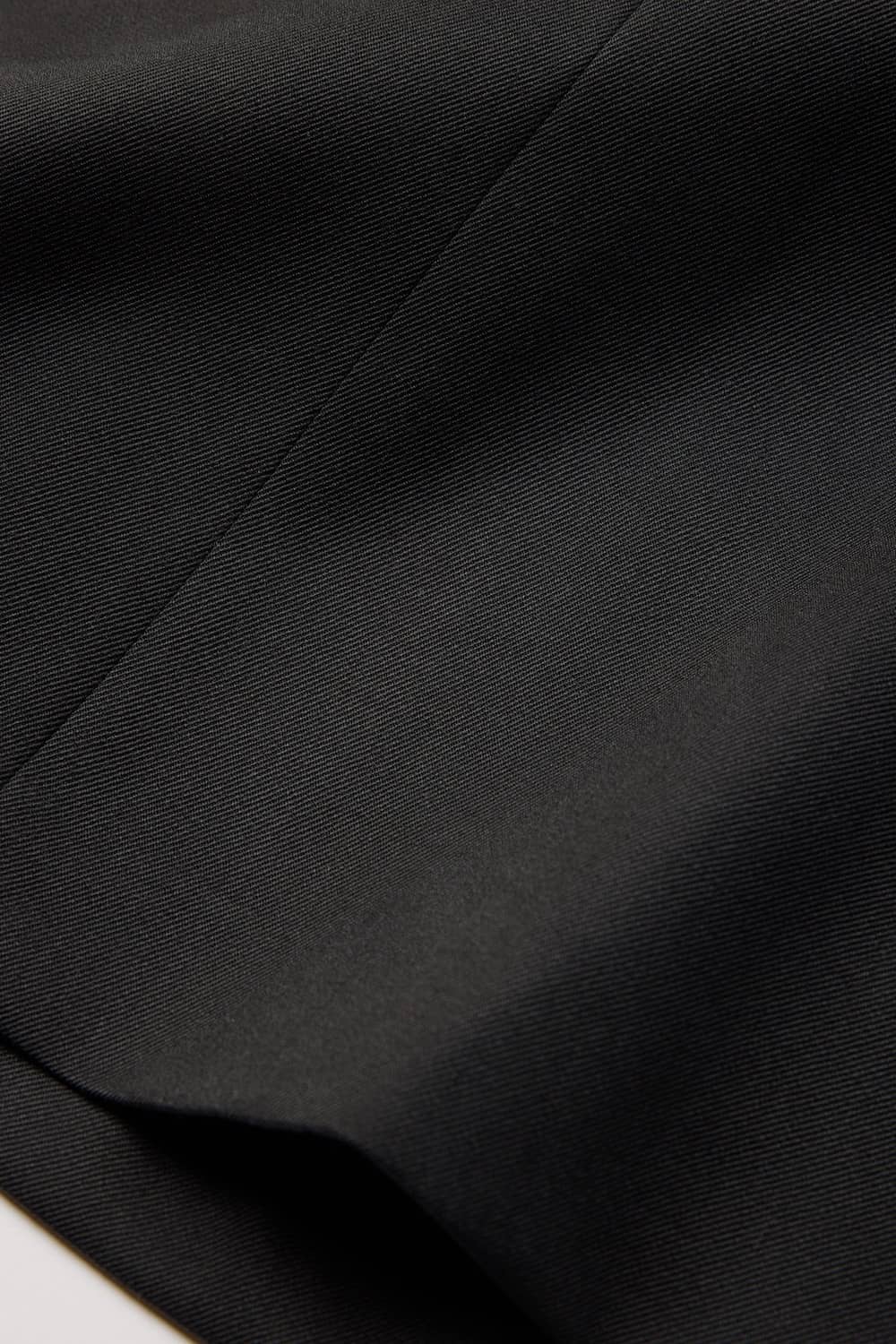 Soft merino twill lining at waistline and slippery cupro-lined body