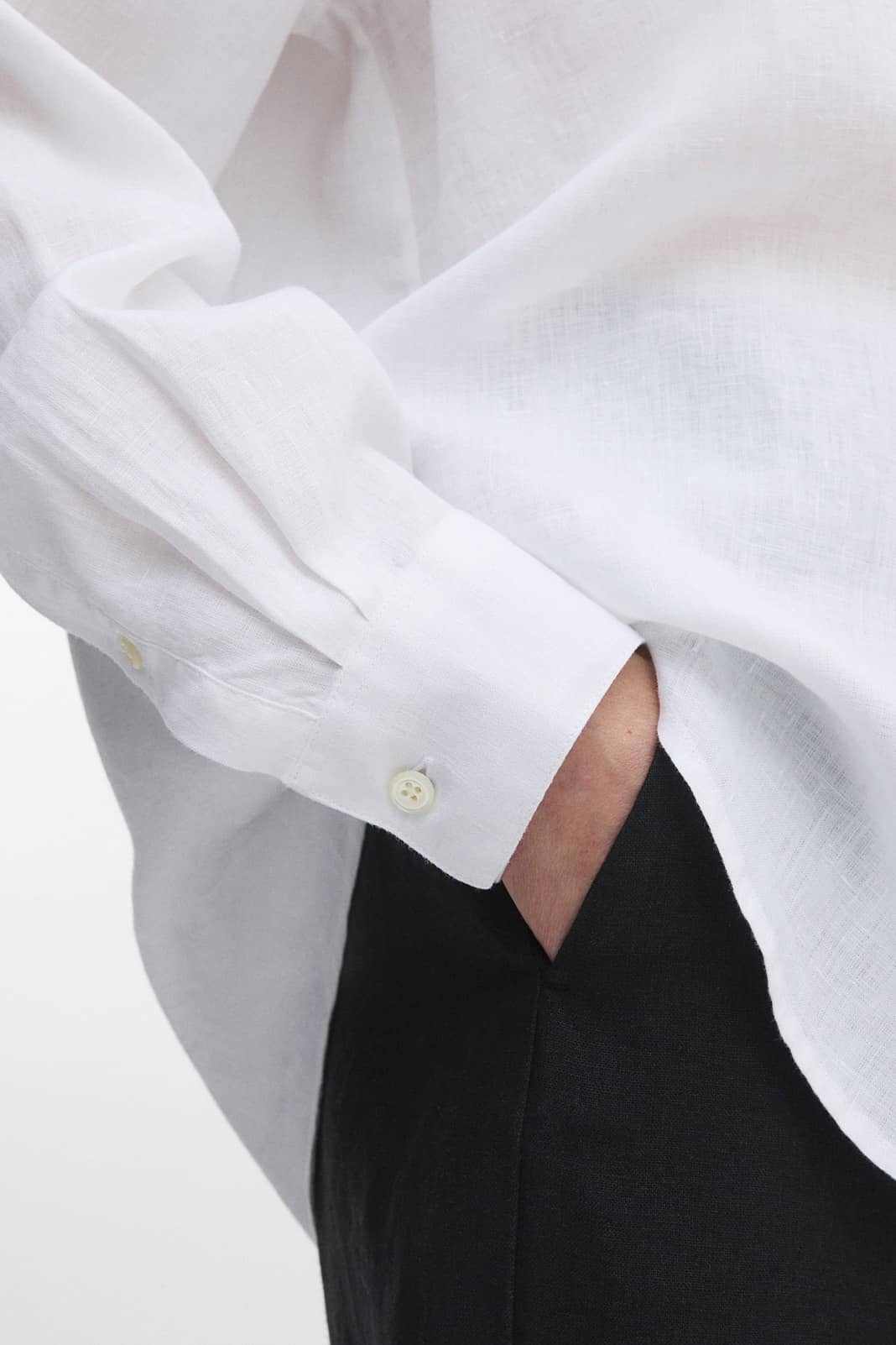 Knife pleats and sharp, single buttoned cuffs