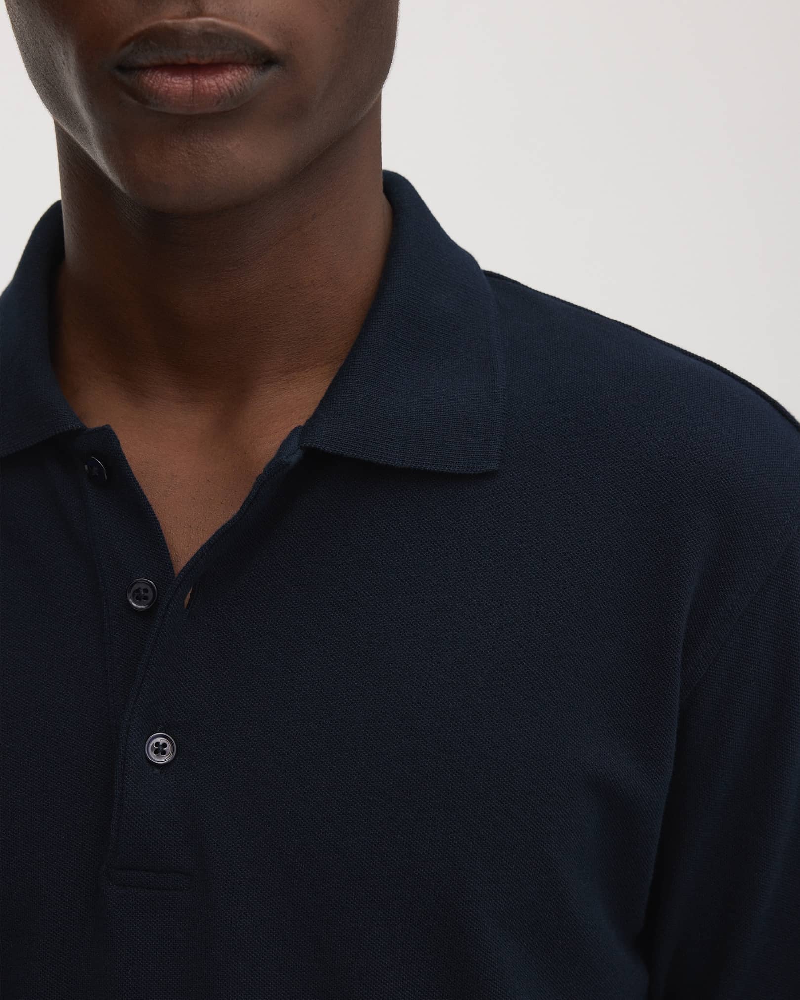 French three-button placket with tonal Mother of Pearl buttons